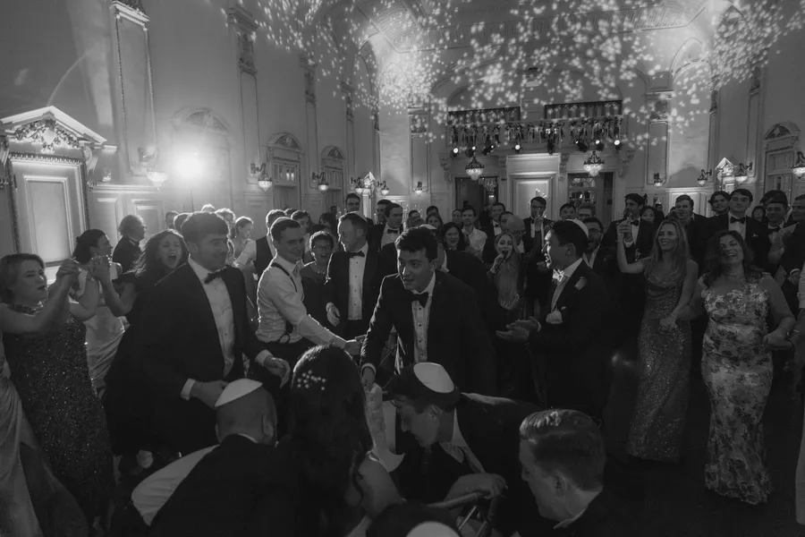 Black-and-white candid from the wedding reception — David and Katia wedding