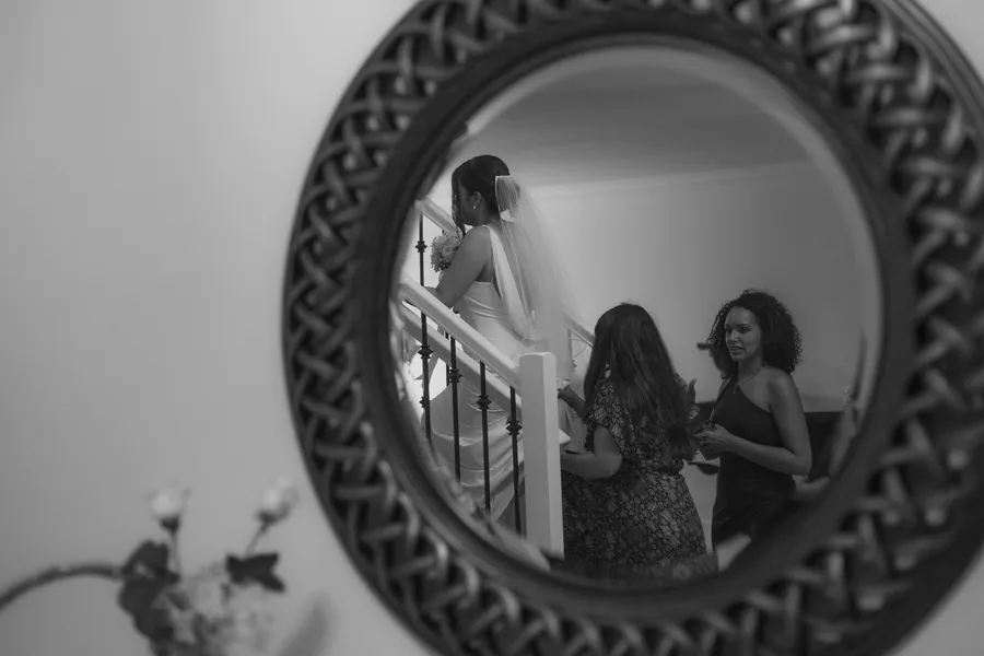 Black-and-white reflection of the bride getting ready — Chris and Laura wedding