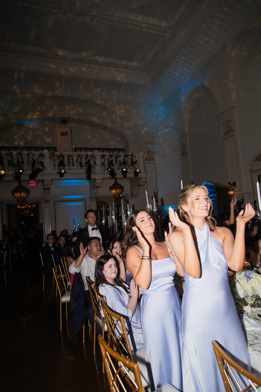 Wedding guests cheering during the evening celebration
