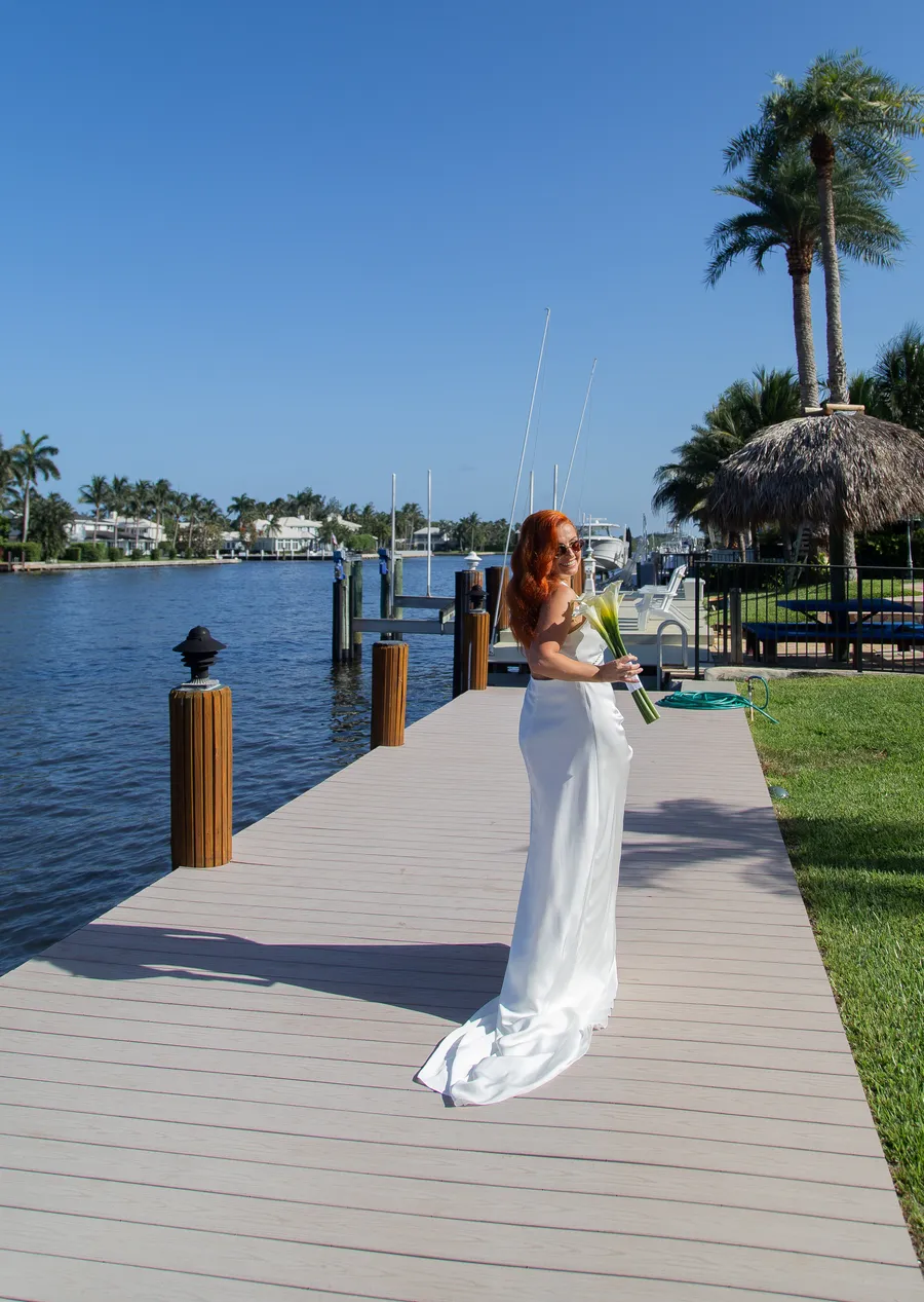 Bride getting ready beside a waterfront pool — Alexander and Olga wedding
