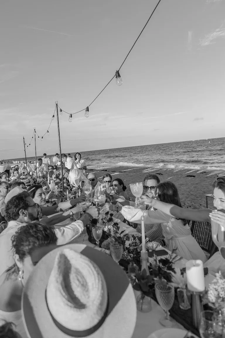 Black-and-white reception dinner beside the ocean