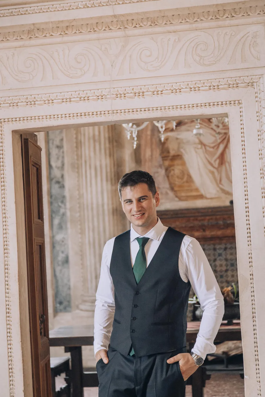 Groom portrait inside an ornate historic room